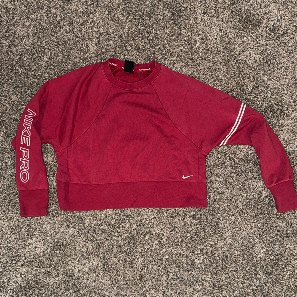 Women’s Nike pro crew sweatshirt size medium.